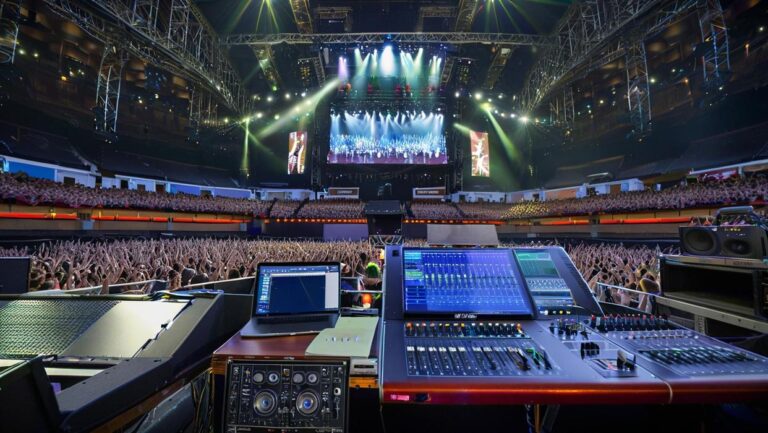 Console DMX Avolites Titan Mobile en action lors d'un mariage, pilotant des projecteurs LED et des moving heads sur une piste